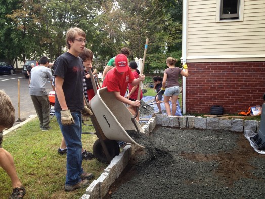 Wellesley's Max Sours (dark shirt) and friends building Zen Garden in Watertown
