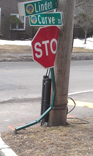 curve street stop sign