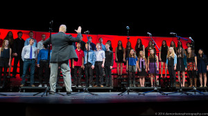 Kevin McDonald conducting WHS singers during fall a cappella concert
