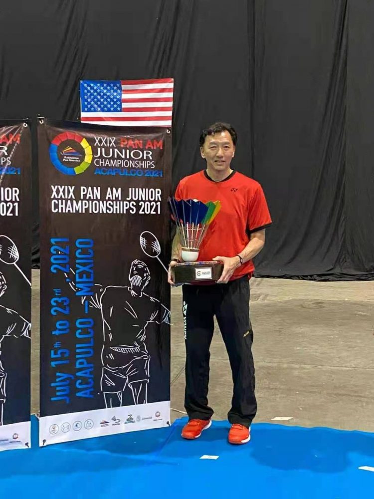 Andy Chong, head coach, leads the USA junior team to win gold medal in team event.