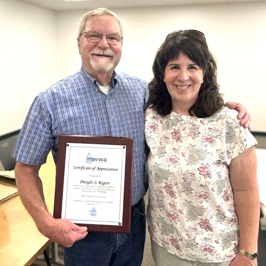 Smitty with Jen Pederson, Executive Director of the Massachusetts Water Works Association, who came to his retirement party to present him with the MWWA’s Certificate of Appreciation. 