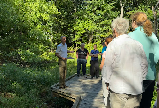 Wellesley Trail Committee Volunteer Rick Mongeau describes the North 40 vernal pool during Friday’s September 18th., 2026 hike. (Photo/Claire Curtis)